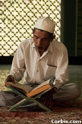 A man reads his Koran in the Omar Ali Saifuddin Mosque. The majority of the population are Malays, but the minority Chinese dominate the economy. Malay and English are the official languages; Islam is the official religion, but there are Buddhist and Christian minorities also. When visiting a mosque, do not walk in front of people in prayer or reading the Koran.